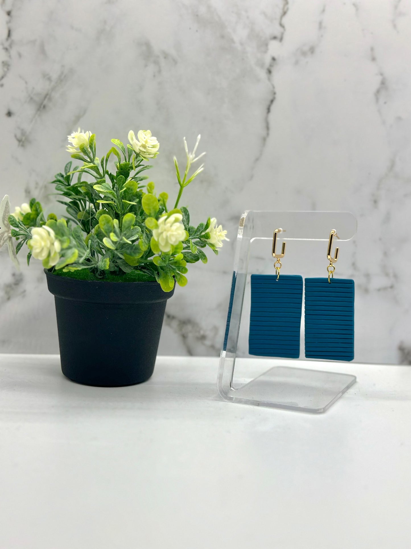 Large rectangular blue dangle earrings inspired by Bermuda cottage shutters, available in small and large sizes by Tassel Bermuda.