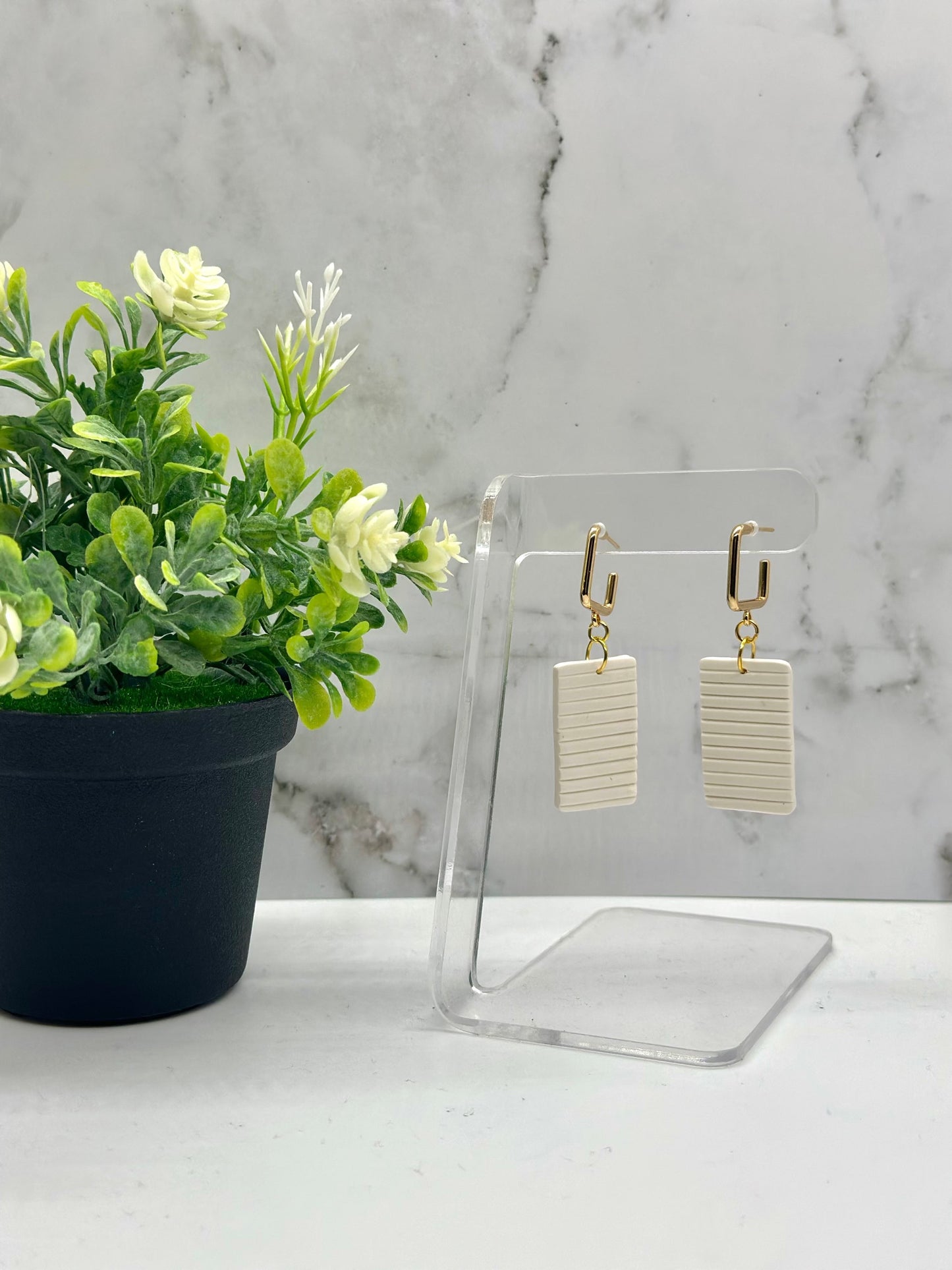 Small rectangular white dangle earrings inspired by Bermuda cottage shutters, available in small and large sizes by Tassel Bermuda.