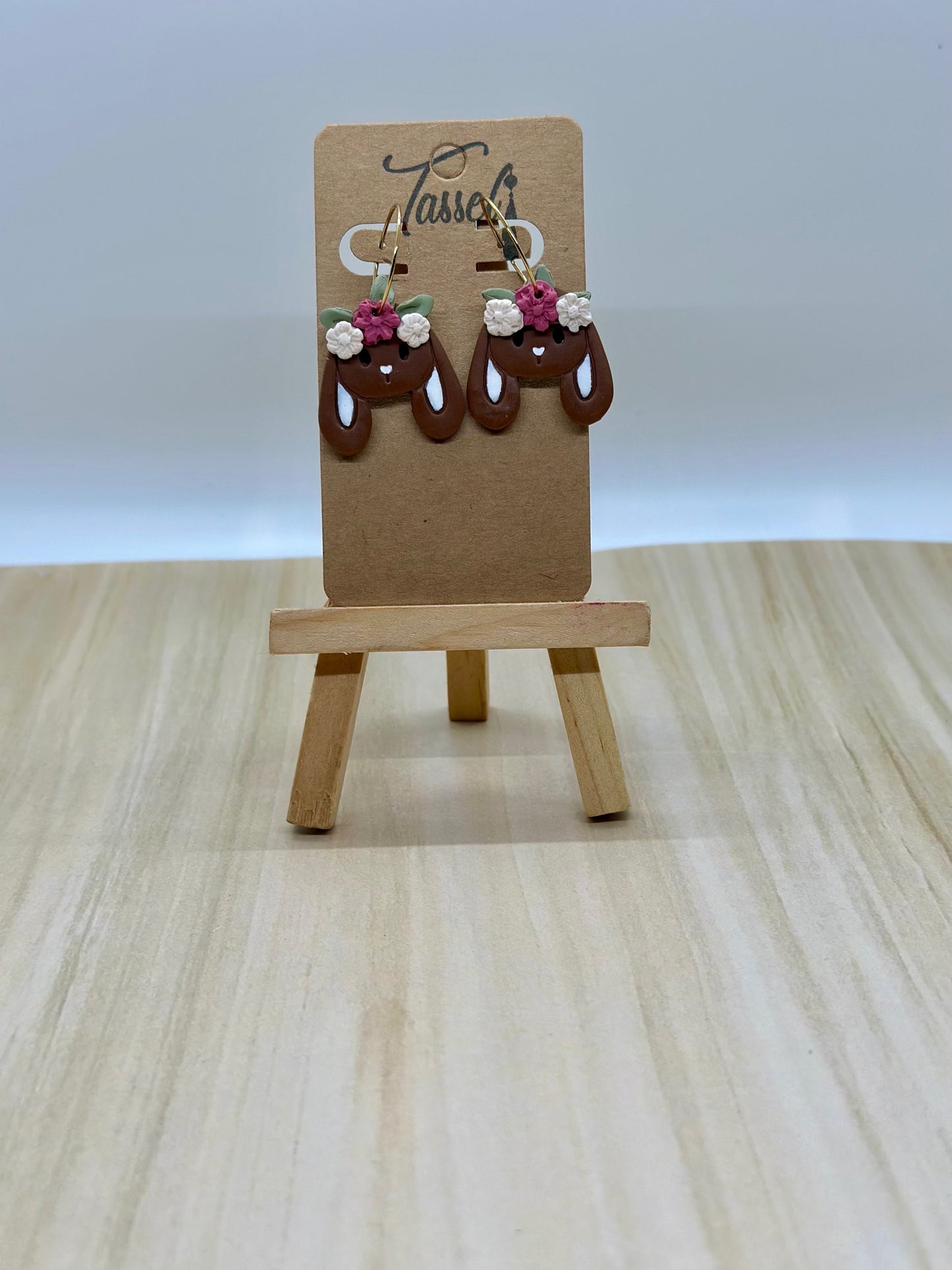 Chocolate Bunny huggie dangle earrings shaped like chocolate bunnies with hand-painted faces and flower crowns, perfect for Easter style.