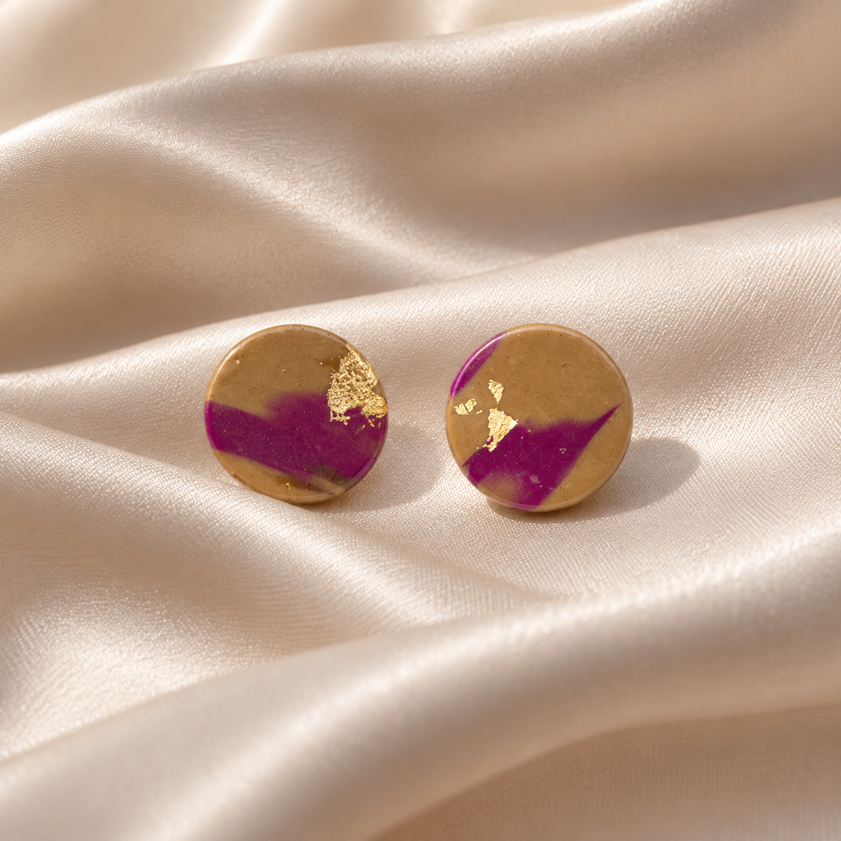 Fall handcrafted polymer clay round stud earrings in caramel brown and magenta with gold foil details by Tassel Bermuda