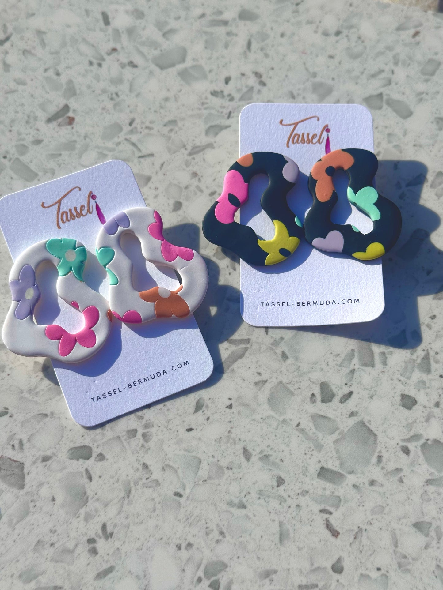 Funky polymer clay earrings with pastel flower shapes and unique silhouettes