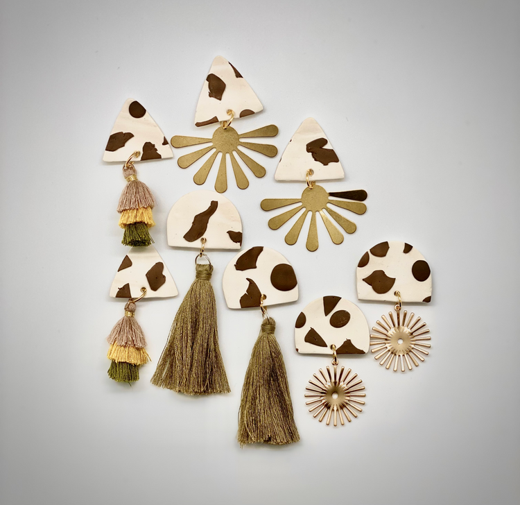 Bold animal-inspired clay earrings in handmade style