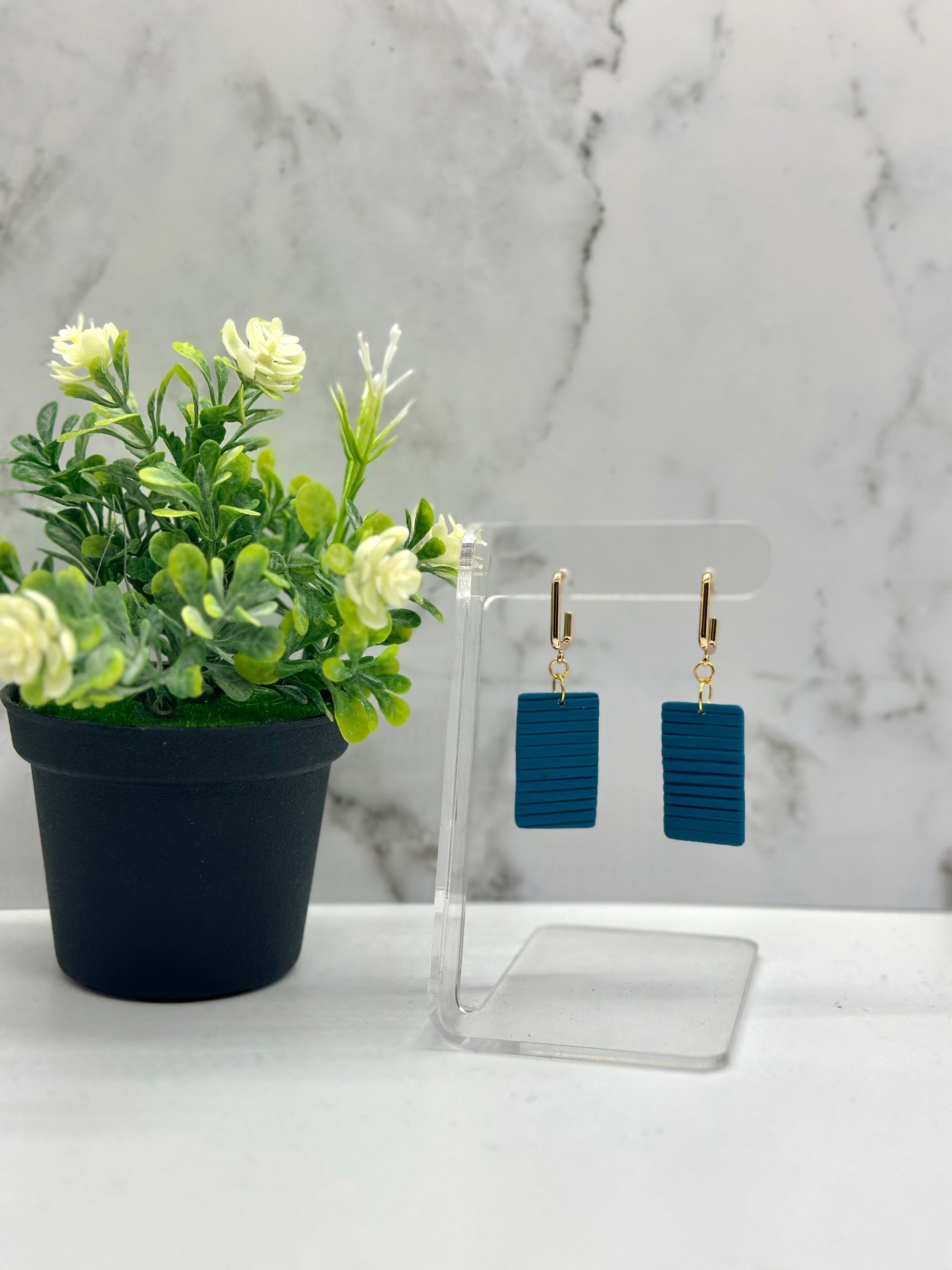 Small rectangular bermuda blue dangle earrings inspired by Bermuda cottage shutters, available in small and large sizes by Tassel Bermuda.