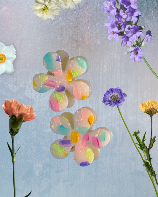 Large flower-shaped polymer clay stud earrings with glitter and hand-painted accents