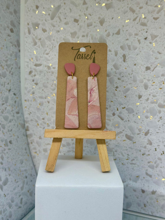 Elegant Blush Waves polymer clay earrings inspired by Bermuda’s pink sand and ocean waves, featuring soft blush tones and flowing wave-like curves.
