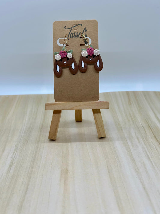 Chocolate Bunny huggie dangle earrings shaped like chocolate bunnies with hand-painted faces and flower crowns, perfect for Easter style.