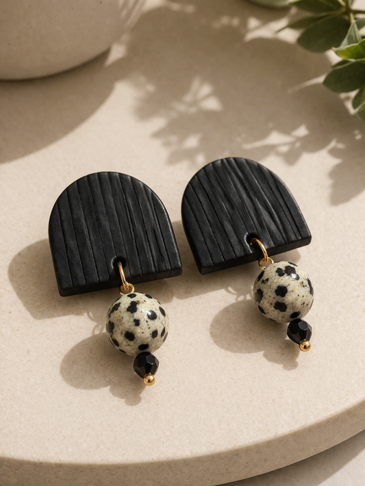 Ink & Stone polymer clay embellished stud earrings with textured black arch and speckled stone bead with gold accents