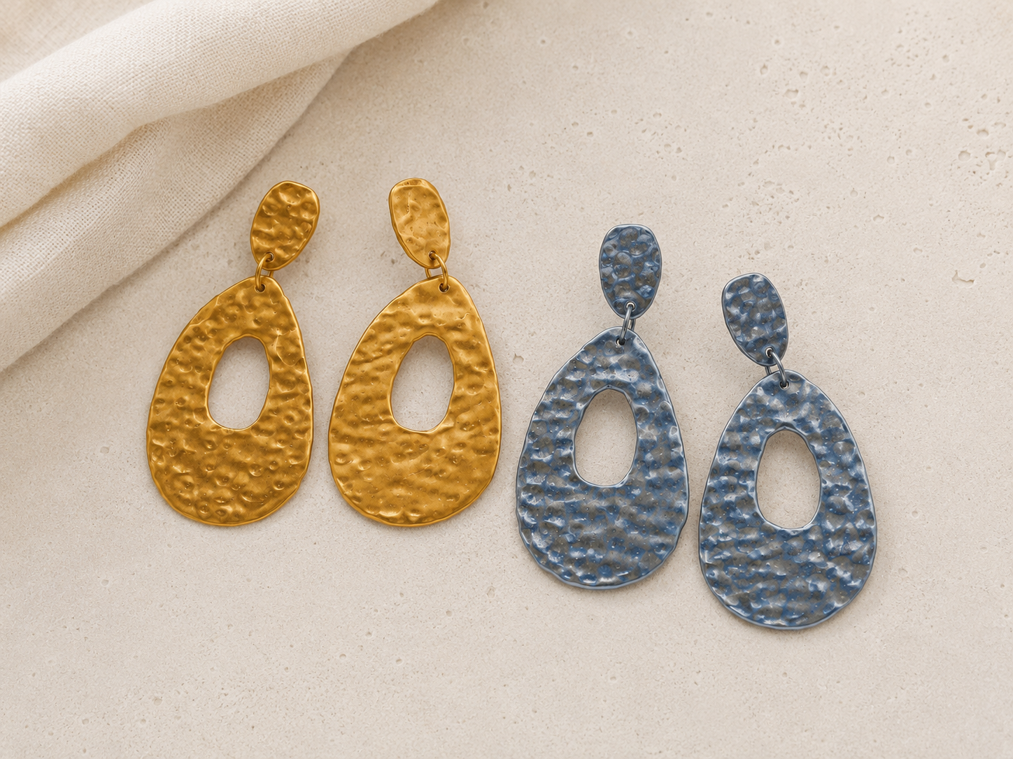 Lightweight hammered metal mesh dangle earrings in gold and silver with an open teardrop design by Tassel Bermuda.