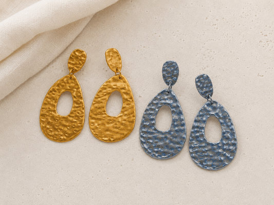 Lightweight hammered metal mesh dangle earrings in gold and silver with an open teardrop design by Tassel Bermuda.