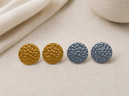 Lightweight hammered metal mash jumbo stud earrings in gold and silver with a modern textured design by Tassel Bermuda.