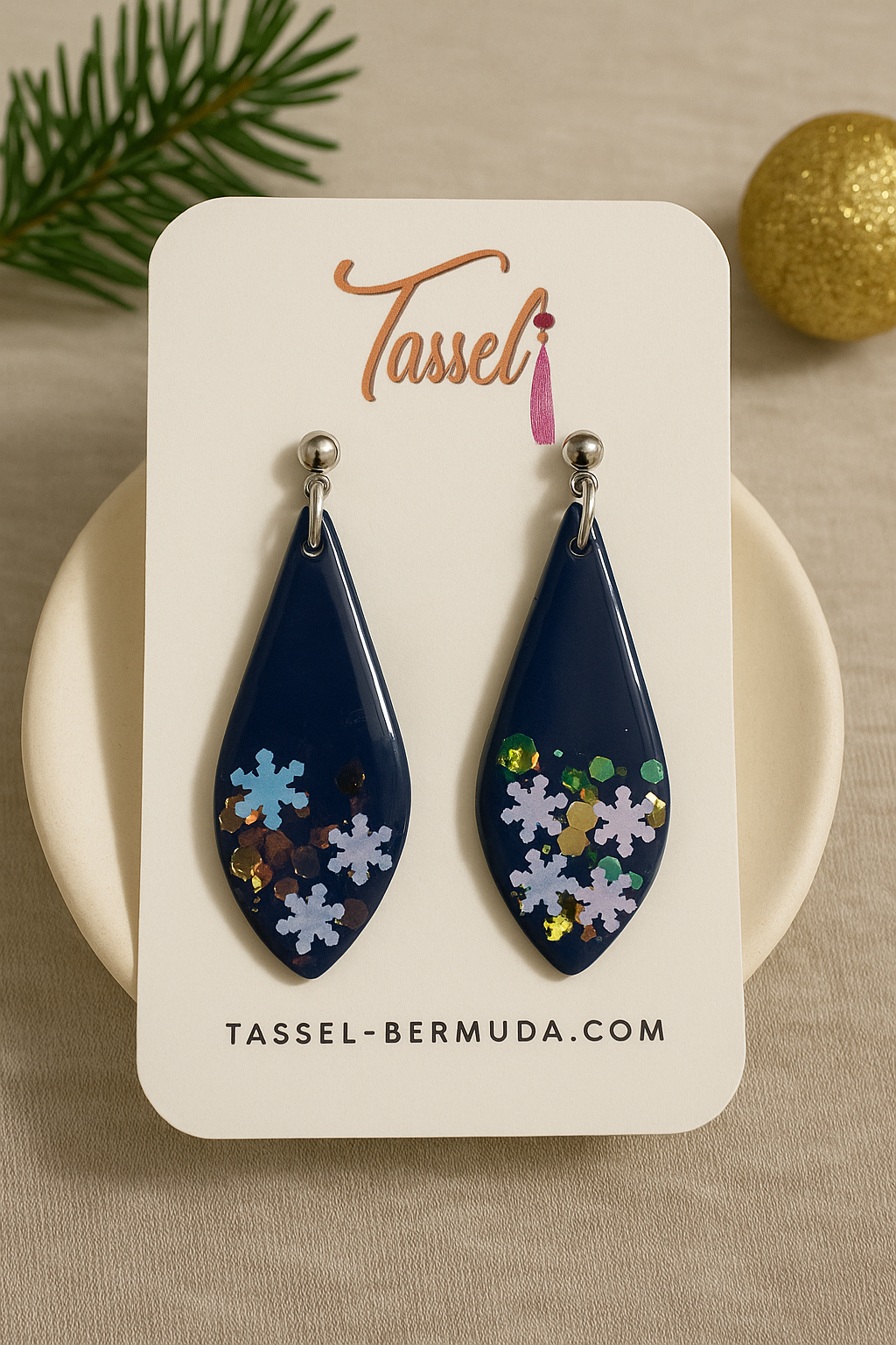 Teardrop-shaped earrings with floral designs Midnight Frost polymer clay dangle earrings featuring deep navy color with iridescent snowflake-like details and glossy resin finish.