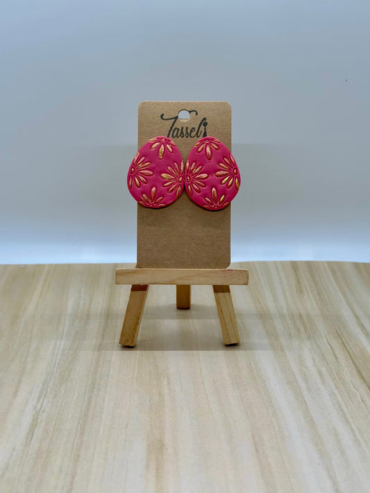 Ness jumbo polymer clay egg-shaped stud earrings with shimmering gold-painted details, inspired by Easter.