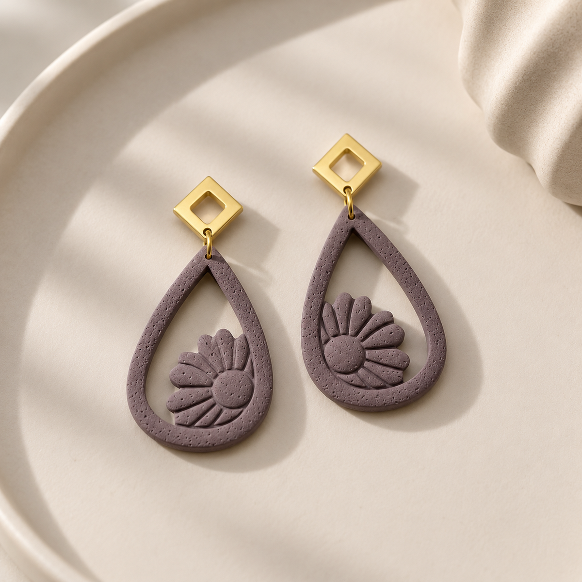 Petal mauve floral polymer clay teardrop dangle earrings with gold-tone studs by Tassel Bermuda