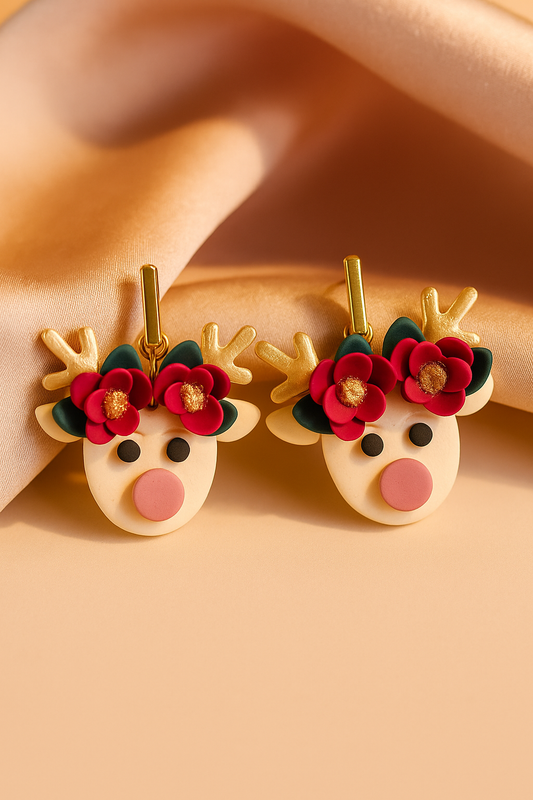 Reindeer-shaped earrings with floral antlers on a beige background