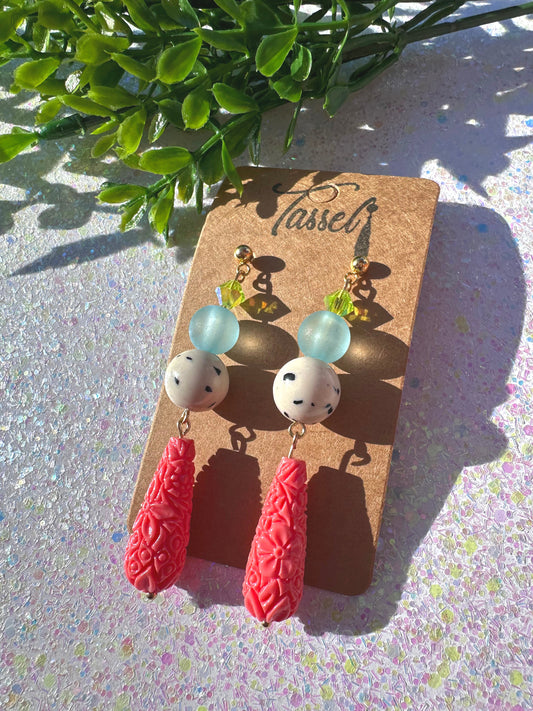 Bold Tyla beaded dangle earrings featuring sculptural shapes, textured patterns, and elegant design in polymer clay.
