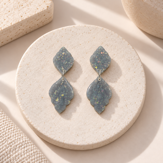 Winter Morning grey polymer clay dangle earrings with iridescent flecks in leaf dangle designs by Tassel Bermuda